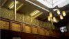 Fieldgate St interior- panelling by ladies gallery covered with memorial plaques detailing names and money donated to the synagogue