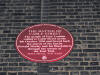 Plaque commemorating the Battle of Cable Street, Dock Street junction with Cable Street