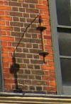 Bobbin on wall of 19 Princelet Street depicting that this was a Huguenot weaver's premises